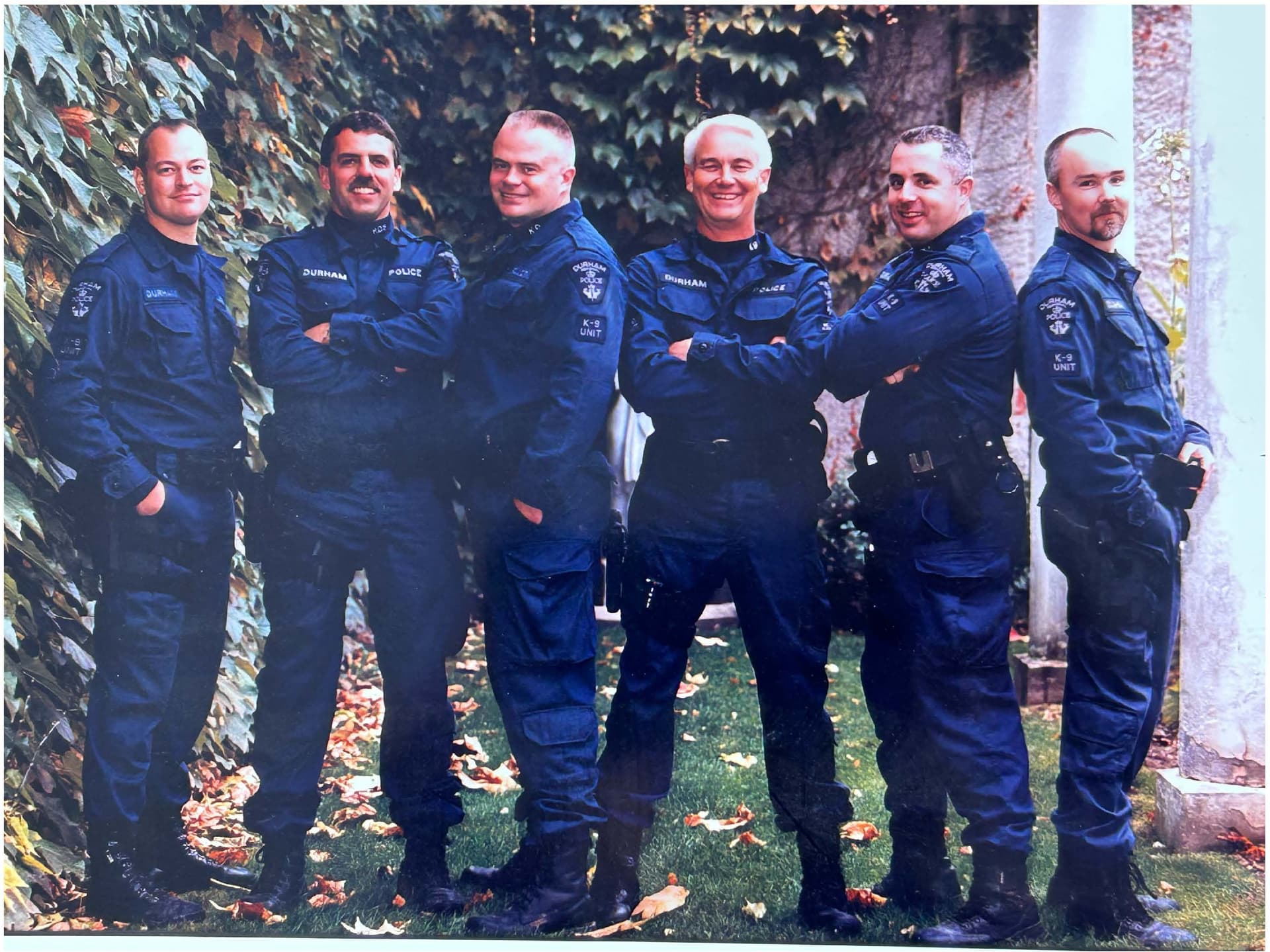 A group of police officers standing next to each other